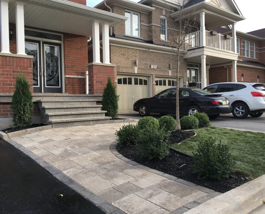 Front interlocking walkway with flagstone porch. Front Landscaping Contractor