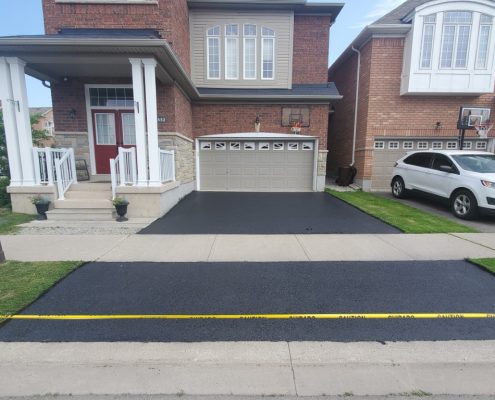 Residential driveway that has been sealed.