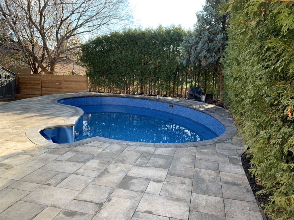 backyard pool with new interlocking