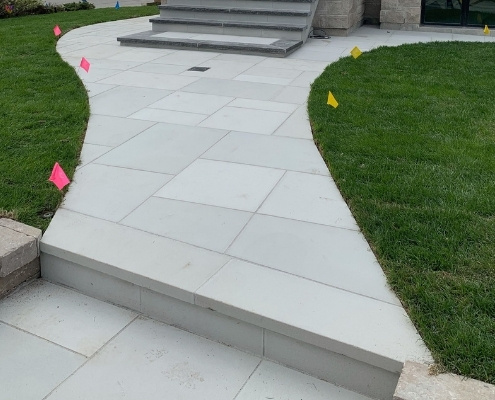 Image depicts flagstone walkway and steps that were recently repaired by AHA.