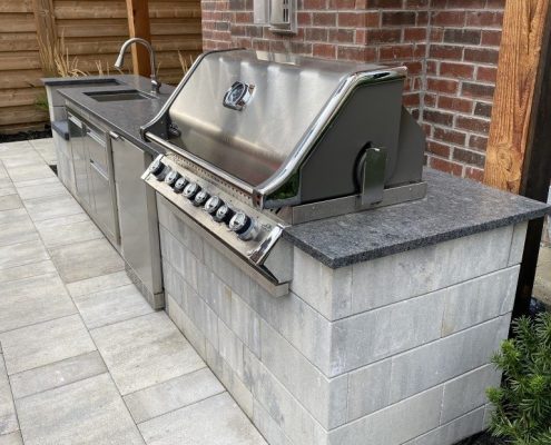 Newly installed outdoor kitchen with a barbecue by AHS