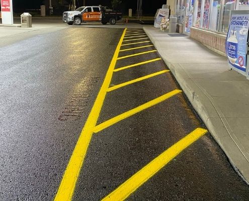 Traffic markings at a gas station painted by AHS.