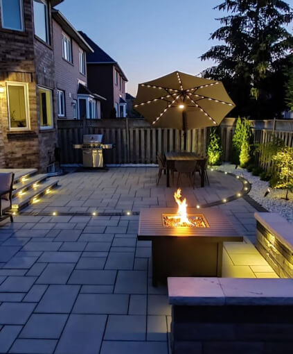 Backyard Interlocking patio design with night lighting in Toronto