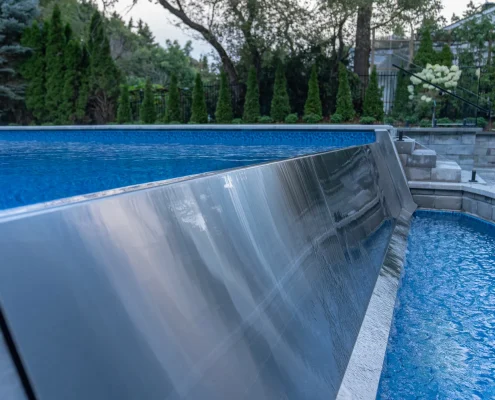 custom pool design with glass fencing