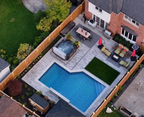 luxury backyard installation with pool and hot tub