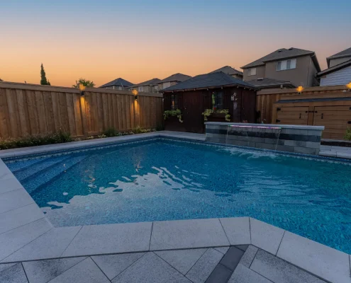 underground pool and fireplace for backyard entertainment