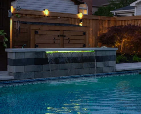 underground pool installation with hot tub and fireplace