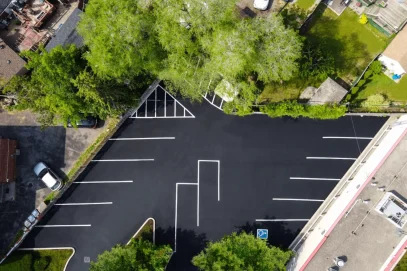 Parking Lot Sealing and Line Painting Over Freshly Paved Asphalt